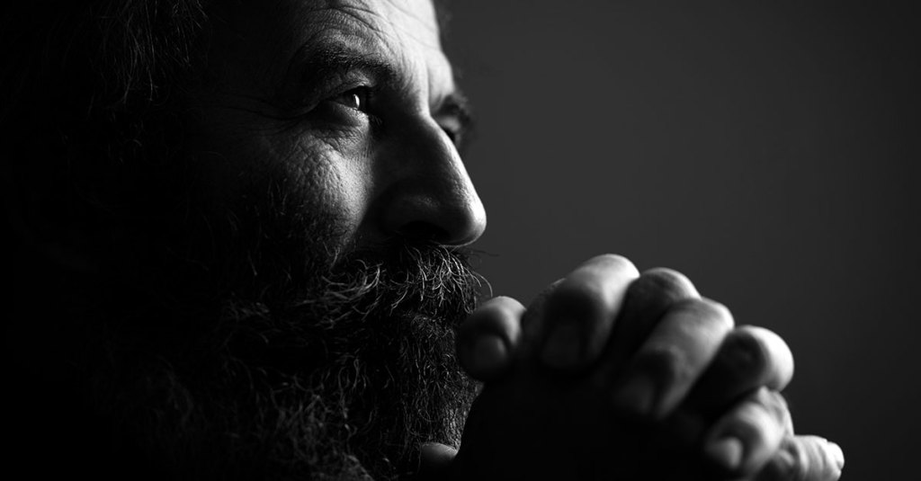 close up of man praying