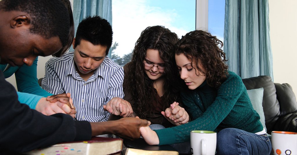 College youth group praying together